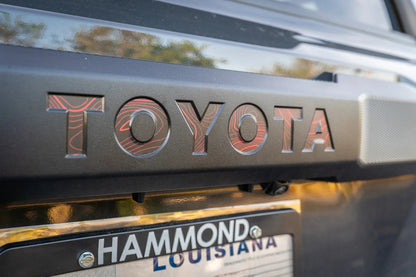 TOYOTA Topographic Rear Liftgate Emblem Inlays - 2025+ 4Runner - 254RUN-RT-TOYOTA-TPWH-254RUN-RT-TOYOTA-TPRACE-254RUN-RT-TOYOTA-TPHB-254RUN-RT-TOYOTA-TPVB-254RUN-RT-TOYOTA-TPAG-  DRIVEN - 1