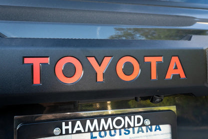 TOYOTA Emergency Reflective Rear Hatch Liftgate Emblem Overlays - 2025+ 4Runner - 24LC250-RTE-TOYOTA-WH-24LC250-RTE-TOYOTA-MB-24LC250-RTE-TOYOTA-BL-24LC250-RTE-TOYOTA-OR-24LC250-RTE-TOYOTA-PI-  DRIVEN - 1
