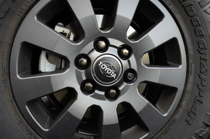 OEM Wheel Cap Overlays - 2024+ Land Cruiser / Tacoma / 2025+ 4Runner - 24LANDCRUISERWC-TYHER-24LANDCRUISERWC-WHBKM-24LANDCRUISERWC-BKM-  DRIVEN - 13