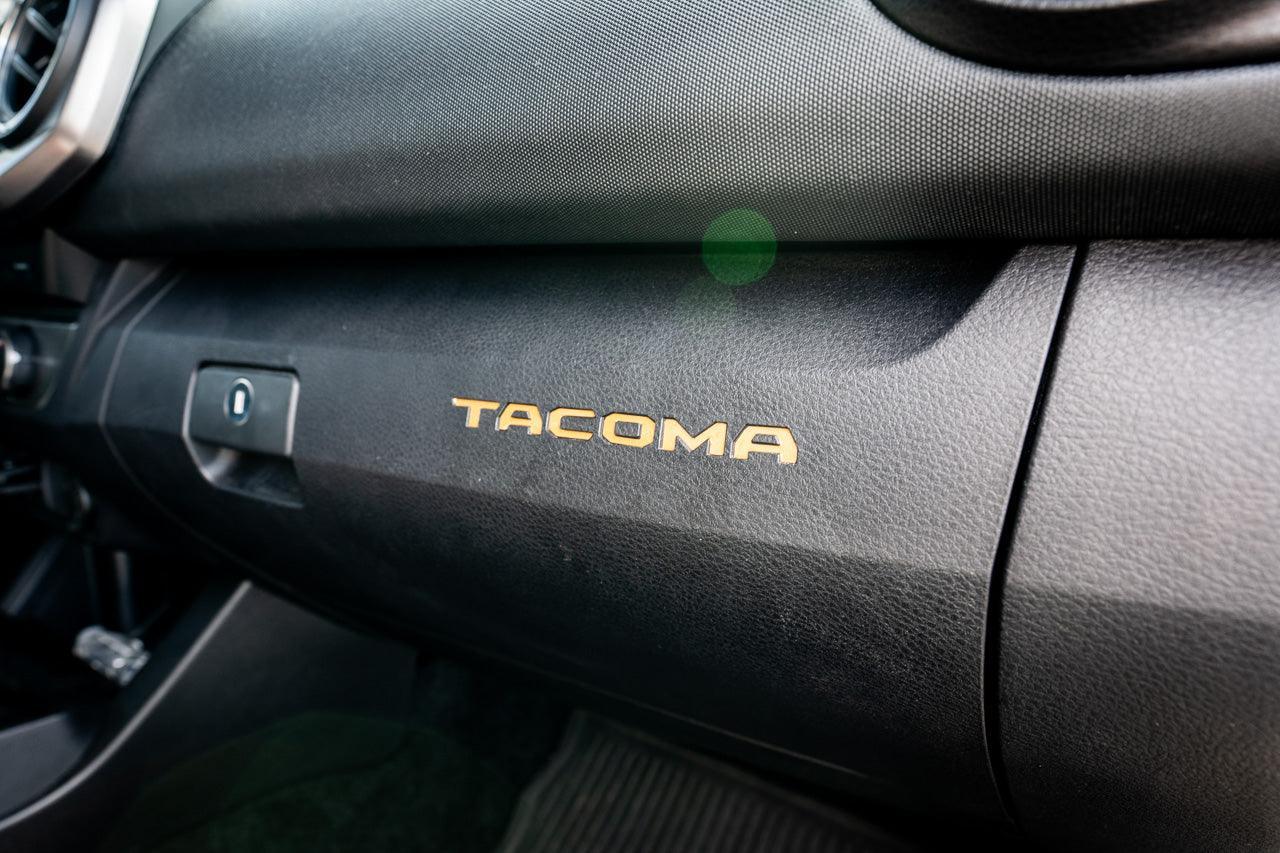 Glove Box "TACOMA" Logo Inlays (Standard Series) - 2016-2023 Tacoma - 16TACOGLOVEINLAY-BO-16TACOGLOVEINLAY-BG-16TACOGLOVEINLAY-RD-16TACOGLOVEINLAY-WH-16TACOGLOVEINLAY-BL-  DRIVEN - 1