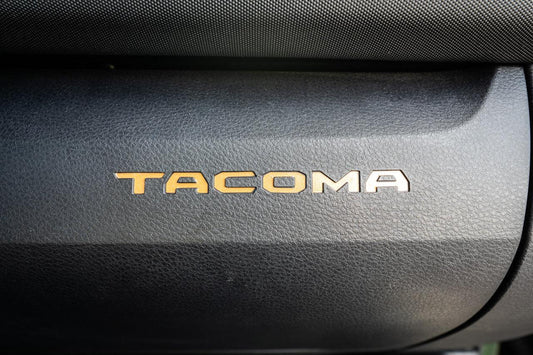 Glove Box "TACOMA" Logo Inlays (Standard Series) - 2016-2023 Tacoma - 16TACOGLOVEINLAY-BO-16TACOGLOVEINLAY-BG-16TACOGLOVEINLAY-RD-16TACOGLOVEINLAY-WH-16TACOGLOVEINLAY-BL-  DRIVEN - 2