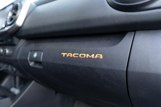 Glove Box "TACOMA" Logo Inlays (Printed Series) - 2016-2023 Tacoma - 16TACOGLOVEINLAYPT-TRD-  DRIVEN - 1