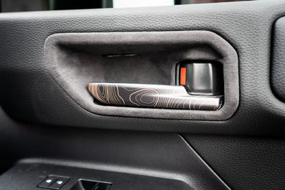 Topographic Interior Door Handle Overlays - 2024+ Land Cruiser - 24LC250-IDH-TP.WH-24LC250-IDH-TP.JA-24LC250-IDH-TP.HB-24LC250-IDH-TP.VB-24LC250-IDH-TP.AG-  DRIVEN - 1