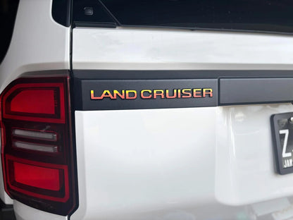 "Land Cruiser" Rear Tailgate Emblem Overlays - 2024+ Land Cruiser - 24LC250-RT-LC-WH-24LC250-RT-LC-MB-24LC250-RT-LC-BL-24LC250-RT-LC-GR-24LC250-RT-LC-OR-  DRIVEN - 1