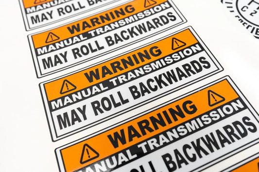 Manual Transmission May Roll Back Warning Sticker 6.5"  - Universal - sfbMTMRB-65-  DRIVEN - 2