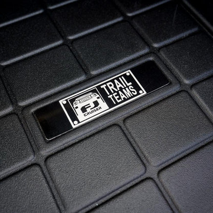 Toyota FJ Cruiser Trail Teams Floor Mat Logo Insert (Etched Metal) - Universal - UNIVERSALWTETCH-FJTT1-UNIVERSALWTETCH-FJTT2-  DRIVEN - 1