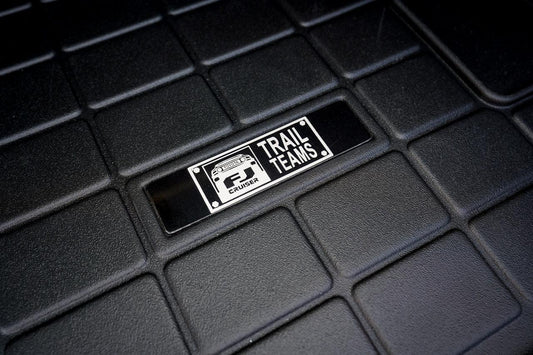 Toyota FJ Cruiser "Trail Teams" Weathertech Floor Mat Logo (Etched Metal) - Universal - UNIVERSALWTETCH-FJTT1-UNIVERSALWTETCH-FJTT2-  DRIVEN - 1