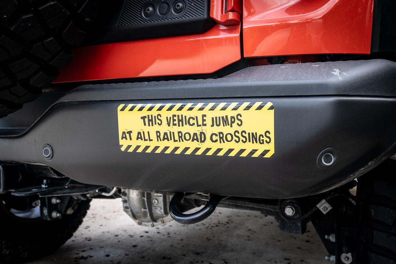 Warning Sticker "This vehicle jumps at all railroad crossings" - Universal - JUMPFUNNY.2-JUMPSERIOUS.1-  DRIVEN - 1
